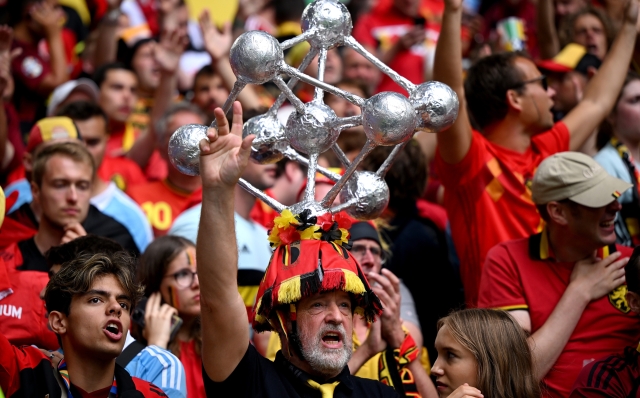 DUSSELDORF, GERMANY - JULY 01: A fan of Belgium, wearing a replica of The Atomium statue, enjoys the pre match atmosphere prior to the UEFA EURO 2024 round of 16 match between France and Belgium at Düsseldorf Arena on July 01, 2024 in Dusseldorf, Germany. (Photo by Clive Mason/Getty Images)