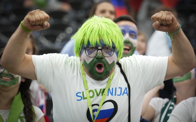 A supporter of Slovenia cheers for the national team prior to a round of sixteen match between Portugal and Slovenia at the Euro 2024 soccer tournament in Frankfurt, Germany, Monday, July 1, 2024. (AP Photo/Ebrahim Noroozi)
