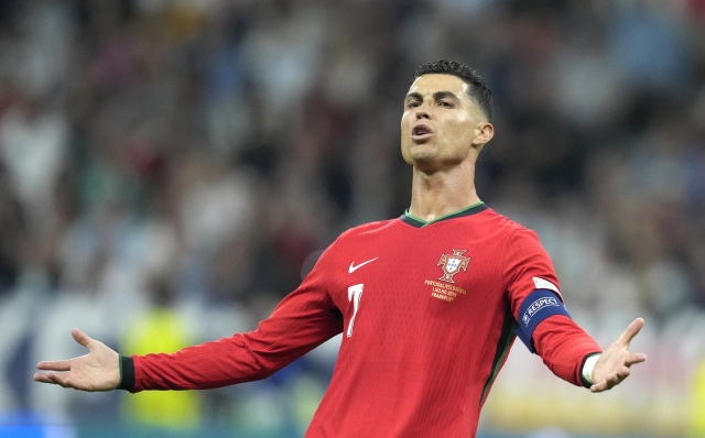 Portugal's Cristiano Ronaldo reacts during a round of sixteen match between Portugal and Slovenia at the Euro 2024 soccer tournament in Frankfurt, Germany, Monday, July 1, 2024. (AP Photo/Ebrahim Noroozi)