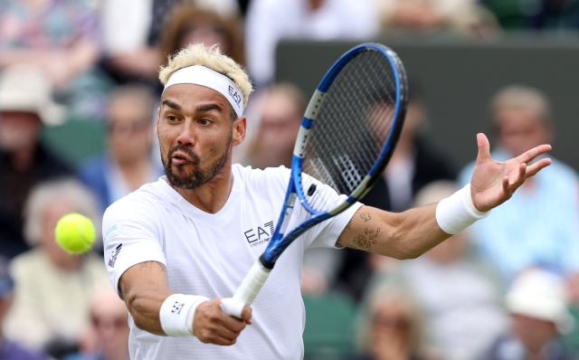 LONDON, ENGLAND - JULY 03: Fabio Fognini of Italy plays a backhand against Casper Ruud of Norway in his Men's Singles second round match during day three of The Championships Wimbledon 2024 at All England Lawn Tennis and Croquet Club on July 03, 2024 in London, England. (Photo by Clive Brunskill/Getty Images) *** BESTPIX ***