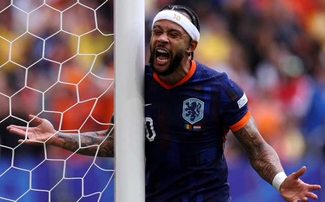 MUNICH, GERMANY - JULY 02: Memphis Depay of the Netherlands reacts to a missed chance on goal during the UEFA EURO 2024 round of 16 match between Romania and Netherlands at Munich Football Arena on July 02, 2024 in Munich, Germany. (Photo by Dean Mouhtaropoulos/Getty Images)