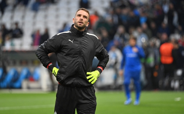Marseille's Spanish goalkeeper #16 Pau Lopez looks on during the warm-up ahead of the UEFA Europa League semi-final first leg football match between Olympique de Marseille (OM) and Atalanta at the Stade Velodrome in Marseille, southern France, on May 2, 2024. (Photo by Sylvain THOMAS / AFP)
