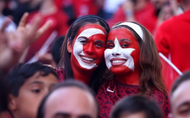 BERLIN, GERMANY - JULY 06: Fans of Turkiye, wearing face paint in the shape of the national flag, pose for a photo on the inside of the stadium prior to the UEFA EURO 2024 quarter-final match between Netherlands and Türkiye at Olympiastadion on July 06, 2024 in Berlin, Germany. (Photo by Alex Grimm/Getty Images)