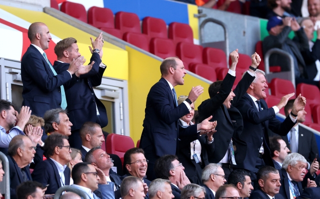 DUSSELDORF, GERMANY - JULY 06: Prince William, Prince of Wales and President of The Football Association, celebrates after Bukayo Saka of England (not pictured) scores his team's first goal during the UEFA EURO 2024 quarter-final match between England and Switzerland at Düsseldorf Arena on July 06, 2024 in Dusseldorf, Germany. (Photo by Carl Recine/Getty Images)