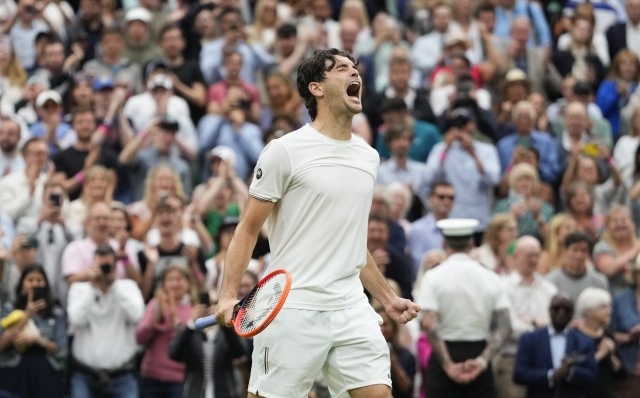 Taylor Fritz of the United States celebrates after defeating Alexander Zverev of Germany in their fourth round match at the Wimbledon tennis championships in London, Monday, July 8, 2024. (AP Photo/Kirsty Wigglesworth)