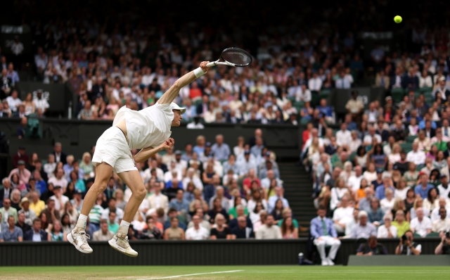 LONDON, ENGLAND - JULY 09: Jannik Sinner of Italy serves to Daniil Medvedev in the Gentlemen's Singles Quarter Final match during day nine of The Championships Wimbledon 2024 at All England Lawn Tennis and Croquet Club on July 09, 2024 in London, England. (Photo by Francois Nel/Getty Images)