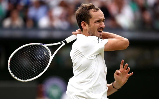 LONDON, ENGLAND - JULY 09: Daniil Medvedev plays a forehand against Jannik Sinner of Italy in the Gentlemen's Singles Quarter Final match during day nine of The Championships Wimbledon 2024 at All England Lawn Tennis and Croquet Club on July 09, 2024 in London, England. (Photo by Francois Nel/Getty Images)