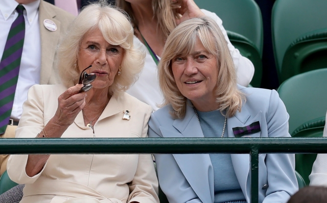 epa11470520 Queen Camilla (L) and former British tennis player Debbie Jevans are seated at Court No.1 for the Men's quarter final match between Lorenzo Musetti of Italy and Taylor Fritz of the USA at the Wimbledon Championships, Wimbledon, Britain, 10 July 2024.  EPA/TIM IRELAND  EDITORIAL USE ONLY