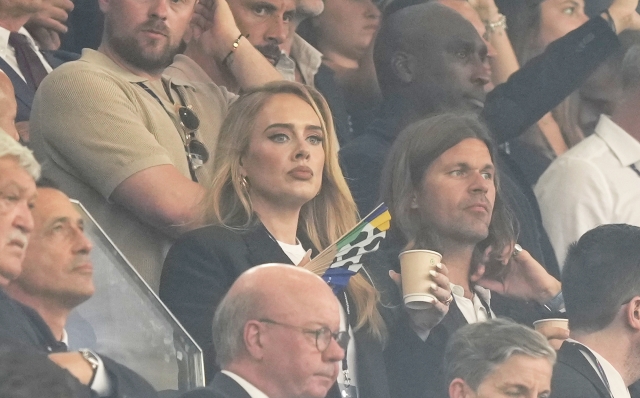 English singer Adele on the stands waits for the start of a semifinal match between the Netherlands and England at the Euro 2024 soccer tournament in Dortmund, Germany, Wednesday, July 10, 2024. (AP Photo/Martin Meissner)