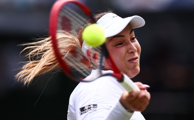 Croatia's Donna Vekic returns against Italy's Jasmine Paolini during their women's singles semi-final tennis match on the eleventh day of the 2024 Wimbledon Championships at The All England Lawn Tennis and Croquet Club in Wimbledon, southwest London, on July 11, 2024. (Photo by HENRY NICHOLLS / AFP) / RESTRICTED TO EDITORIAL USE