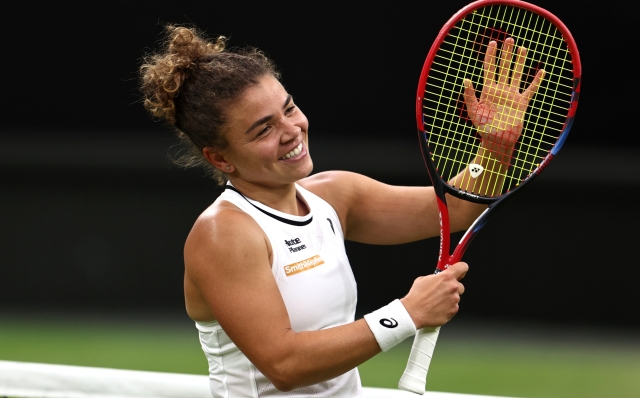 LONDON, ENGLAND - JULY 09: Jasmine Paolini of Italy celebrates winning match point against Emma Navarro of United States in the Ladies' Singles Quarter Final match during day nine of The Championships Wimbledon 2024 at All England Lawn Tennis and Croquet Club on July 09, 2024 in London, England. (Photo by Francois Nel/Getty Images)