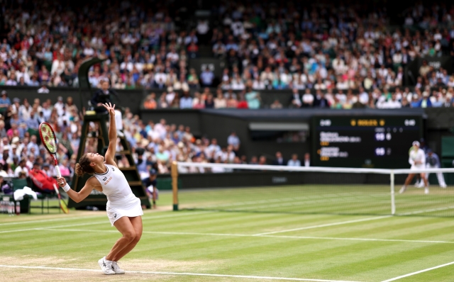 LONDON, ENGLAND - JULY 13: Jasmine Paolini of Italy serves to Barbora Krejcikova of Czechia during her Ladies' Singles Final match during day thirteen of The Championships Wimbledon 2024 at All England Lawn Tennis and Croquet Club on July 13, 2024 in London, England. (Photo by Clive Brunskill/Getty Images)