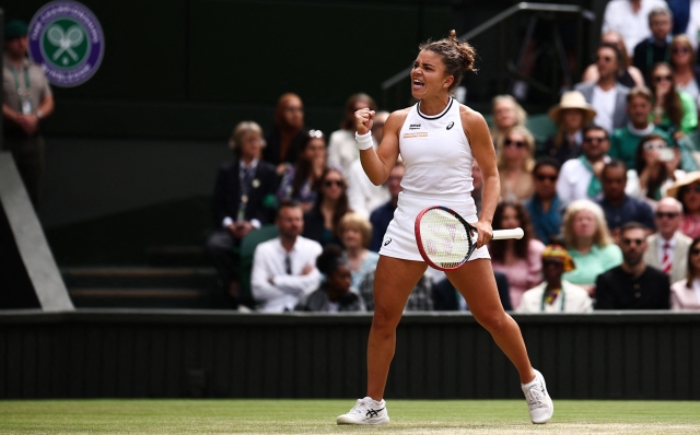 Italy's Jasmine Paolini celebrates winning the second set against Czech Republic's Barbora Krejcikova during their women's singles final tennis match on the thirteenth day of the 2024 Wimbledon Championships at The All England Lawn Tennis and Croquet Club in Wimbledon, southwest London, on July 13, 2024. (Photo by HENRY NICHOLLS / AFP) / RESTRICTED TO EDITORIAL USE