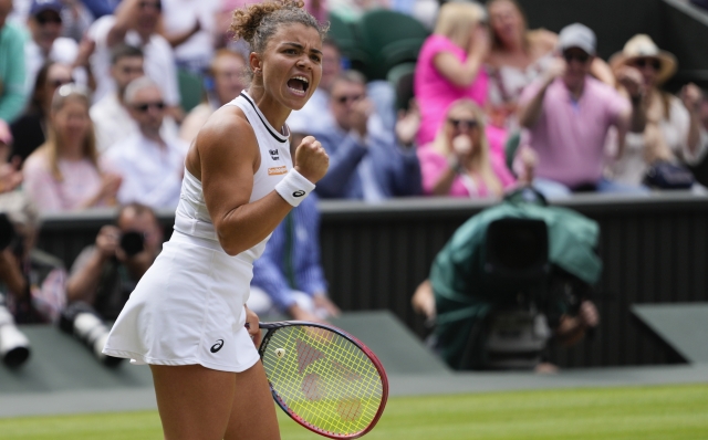 Jasmine Paolini of Italy reacts after winning a point against Barbora Krejcikova of the Czech Republic during the women's singles final at the Wimbledon tennis championships in London, Saturday, July 13, 2024. (AP Photo/Kirsty Wigglesworth)