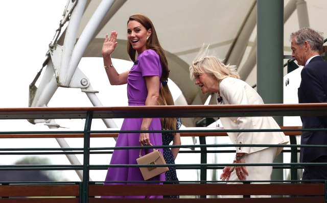 LONDON, ENGLAND - JULY 14: Catherine, Princess of Wales, Patron of The AELTC waves from the player's walkway bridge with Princess Charlotte and Deborah Jevans, Chairwoman of the AELTC during day fourteen of The Championships Wimbledon 2024 at All England Lawn Tennis and Croquet Club on July 14, 2024 in London, England. (Photo by Sean M. Haffey/Getty Images)