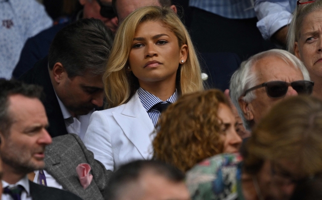 US actress Zendaya (C) watches Spain's Carlos Alcaraz play against Serbia's Novak Djokovic in the men's singles final tennis match on the fourteenth day of the 2024 Wimbledon Championships at The All England Lawn Tennis and Croquet Club in Wimbledon, southwest London, on July 14, 2024. (Photo by ANDREJ ISAKOVIC / AFP) / RESTRICTED TO EDITORIAL USE