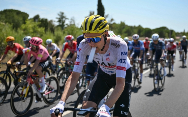 UAE Team Emirates team's Belgian rider Tim Wellens carries an ice pack in his mouth as he cycles during the 16th stage of the 111th edition of the Tour de France cycling race, 188,6 km between Gruissan and Nimes, southern France, on July 16, 2024. (Photo by Marco BERTORELLO / AFP)