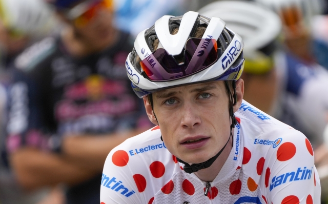 Denmark's Jonas Vingegaard, wearing the best climber's dotted jersey as the runner-up in the ranking, waits for the start of the nineteenth stage of the Tour de France cycling race over 144.6 kilometers (89.9 miles) with start in Embrun and finish in Isola 2000, France, Friday, July 19, 2024. (AP Photo/Jerome Delay)