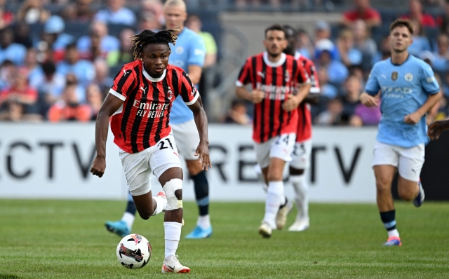 NEW YORK, NEW YORK - JULY 27: Samuel Chukwueze of AC Milan drives the ball during a Pre-Season Friendly match between Manchester City and AC Milan at Yankee Stadium on July 27, 2024 in New York City.   Drew Hallowell/Getty Images/AFP (Photo by Drew Hallowell / GETTY IMAGES NORTH AMERICA / Getty Images via AFP)