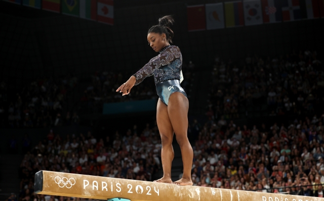 PARIS, FRANCE - JULY 28: Simone Biles of Team United States competes on the balance beam during the Artistic Gymnastics Women's Qualification on day two of the Olympic Games Paris 2024 at Bercy Arena on July 28, 2024 in Paris, France. (Photo by Jamie Squire/Getty Images)