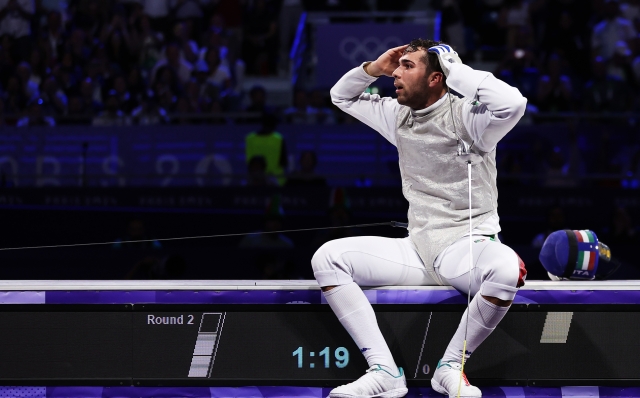 PARIS, FRANCE - JULY 29:Filippo Macchi of team Italy shows his dejection after losing the Fencing Men's Foil Individual Gold Medal Bout on day three of the Olympic Games Paris 2024 at Grand Palais on July 29, 2024 in Paris, France. (Photo by Carl Recine/Getty Images)