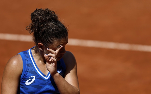 epa11508782 Jasmine Paolini of Italy reacts during the Women's Singles third round match against Anna Karolina Schmiedlova of Slovakia at the Tennis competitions in the Paris 2024 Olympic Games, at the Roland Garros in Paris, France, 30 July 2024.  EPA/RITCHIE B. TONGO