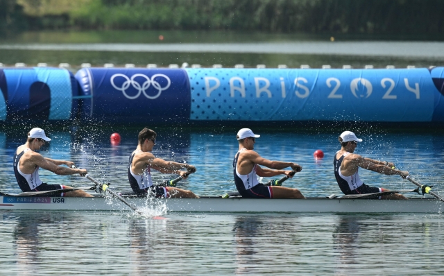 (L-R) US' Nick Mead, Justin Best, Michael Grady and Liam Corrigan compete for the gold medal in the men's four final rowing competition at Vaires-sur-Marne Nautical Centre in Vaires-sur-Marne during the Paris 2024 Olympic Games on August 1, 2024. (Photo by Bertrand GUAY / AFP)