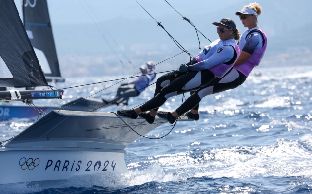 epa11509782 Jana Germani and Giorgia Bertuzzi from Italy in action on their 49er FX skiff during the Men's Skiff opening series race of the Sailing competitions in the Paris 2024 Olympic Games, in Marseille, France, 30 July 2024.  EPA/OLIVIER HOSLET