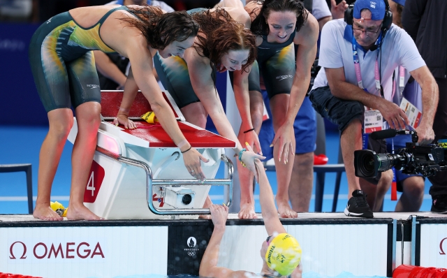 NANTERRE, FRANCE - AUGUST 01: Mollie O'Callaghan, Lani Pallister, Brianna Throssell and Ariarne Titmus of Team Australia celebrate after winning gold in the Women's 4x200m Freestyle Relay Final on day six of the Olympic Games Paris 2024 at Paris La Defense Arena on August 01, 2024 in Nanterre, France. (Photo by Clive Rose/Getty Images)