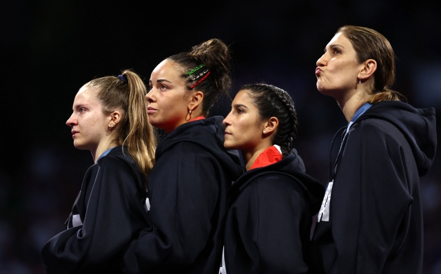 (FromL) Silver medalists Italy's Martina Favaretto, Italy's Alice Volpi, Italy's Francesca Palumbo and Italy's Arianna Errigo pose on the podium during the victory ceremony following the women's foil team gold medal bout between Italy and USA during the Paris 2024 Olympic Games at the Grand Palais in Paris, on August 1, 2024. (Photo by Franck FIFE / AFP)