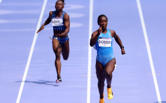 PARIS, FRANCE - AUGUST 02: Zaynab Dosso of Team Italy reacts competes the Women's 100m Round 1 on day seven of the Olympic Games Paris 2024 at Stade de France on August 02, 2024 in Paris, France. (Photo by Steph Chambers/Getty Images)