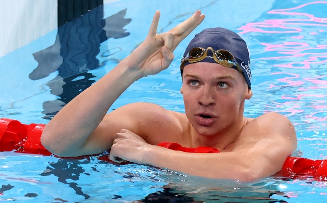 NANTERRE, FRANCE - AUGUST 02: Leon Marchand of Team France celebrates after winning gold in the Men's 200m Individual Medley Final on day seven of the Olympic Games Paris 2024 at Paris La Defense Arena on August 02, 2024 in Nanterre, France. (Photo by Pascal Le Segretain/Getty Images)