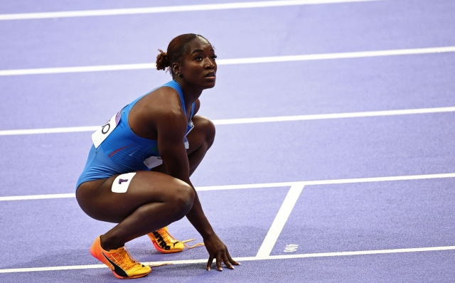 Italy's Zaynab Dosso reacts after competing in the women's 100m semi-final of the athletics event at the Paris 2024 Olympic Games at Stade de France in Saint-Denis, north of Paris, on August 3, 2024. (Photo by Anne-Christine POUJOULAT / AFP)