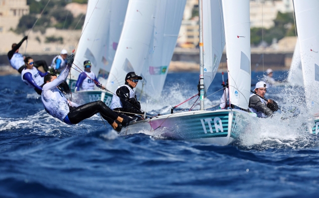 Italy's duo Elena Berta and Bruno Festo compete in race 3 of the mixed 470 double-handed dinghy event during the Paris 2024 Olympic Games sailing competition at the Roucas-Blanc Marina in Marseille on August 3, 2024. (Photo by Clement MAHOUDEAU / AFP)