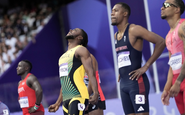 Kishane Thompson, of Jamaica, reacts ahead of the men's 100-meters semifinal at the 2024 Summer Olympics, Sunday, Aug. 4, 2024, in Saint-Denis, France. (AP Photo/Bernat Armangue)