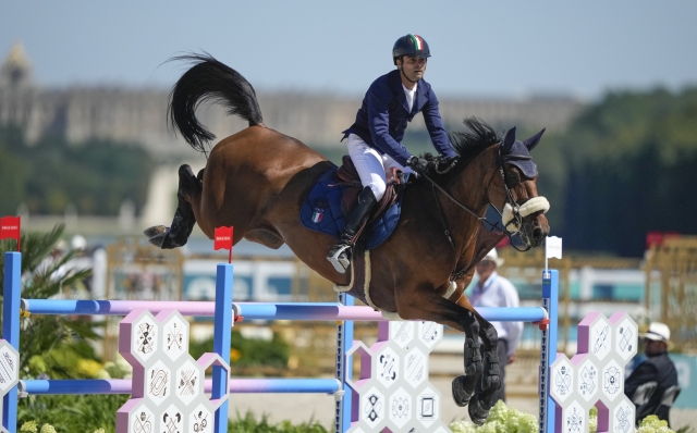 Italy's Emanuele Camilli, riding Odense Odeveld, during the Equestrian Jumping qualifiers, at the 2024 Summer Olympics, Monday, Aug. 5, 2024, in Versailles, France. (AP Photo/Mosa'ab Elshamy)