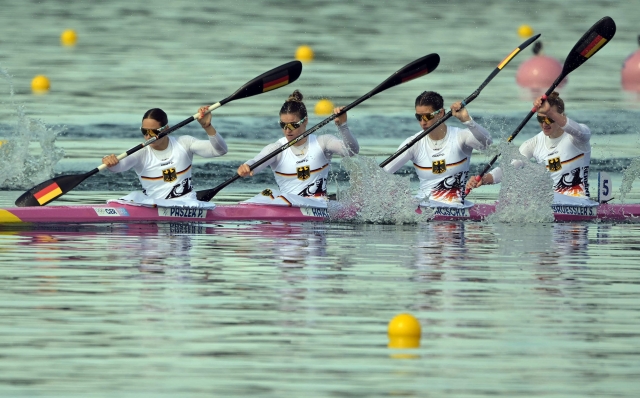 (Front-back) Germany's Paulina Paszek, Germany's Jule Marie Hake, Germany's Pauline Jagsch and Germany's Sarah Bruessler compete in the women's kayak four 500m heats of the canoe sprint competition at Vaires-sur-Marne Nautical Stadium in Vaires-sur-Marne during the Paris 2024 Olympic Games on August 6, 2024. (Photo by Bertrand GUAY / AFP)