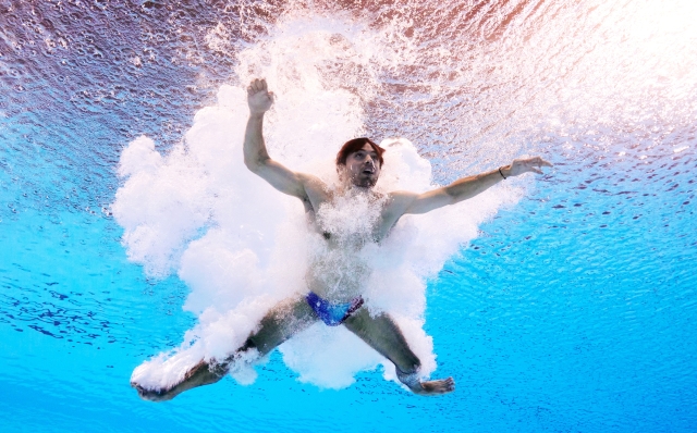 PARIS, FRANCE - AUGUST 06: (EDITORS NOTE: Image was captured using an underwater robotic camera.) Jules Bouyer of Team France competes in the Men's 3m Springboard Preliminary on day eleven of the Olympic Games Paris 2024 at Aquatics Centre on August 06, 2024 in Paris, France. (Photo by Maddie Meyer/Getty Images)