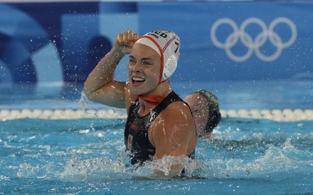 Netherland's Bente Rogge celebrates after scoring a goal during a women's water polo group A preliminary match between the Netherlands and Australia, at the 2024 Summer Olympics, Wednesday, July 31, 2024, in Saint-Denis, France. (AP Photo/Luca Bruno)