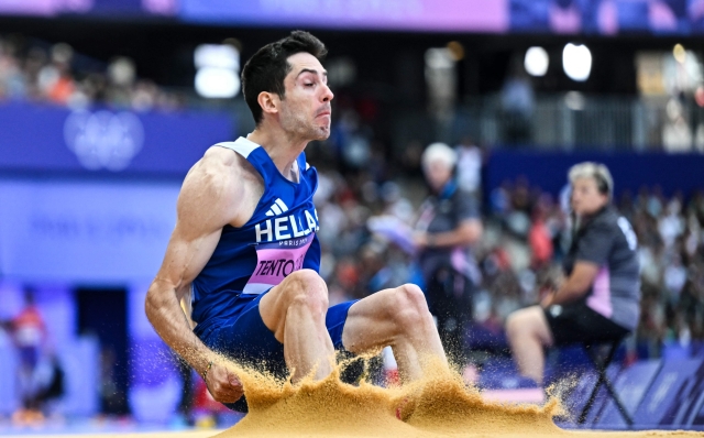 Greece's Miltiadis Tentoglou competes in the men's long jump qualification of the athletics event at the Paris 2024 Olympic Games at Stade de France in Saint-Denis, north of Paris, on August 4, 2024. (Photo by Andrej ISAKOVIC / AFP)