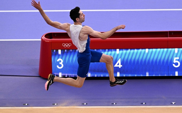 Greece's Miltiadis Tentoglou competes in the men's long jump final of the athletics event at the Paris 2024 Olympic Games at Stade de France in Saint-Denis, north of Paris, on August 6, 2024. (Photo by Kirill KUDRYAVTSEV / AFP)