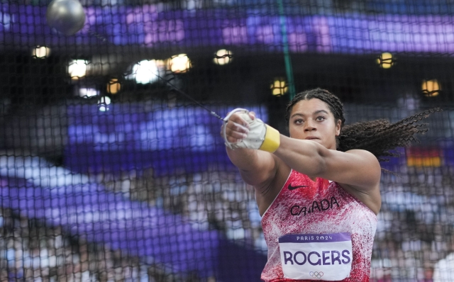 Camryn Rogers, of Canada, competes during the women's hammer throw final at the 2024 Summer Olympics, Tuesday, Aug. 6, 2024, in Saint-Denis, France. (AP Photo/Bernat Armangue)