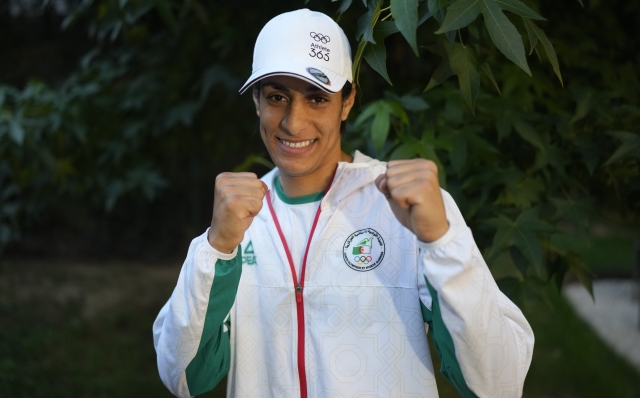 Algerian boxer Imane Khelif poses for a photo after an interview with SNTV at the 2024 Summer Olympics, Sunday, Aug. 4, 2024, in Paris, France. (AP Photo/Vadim Ghirda)