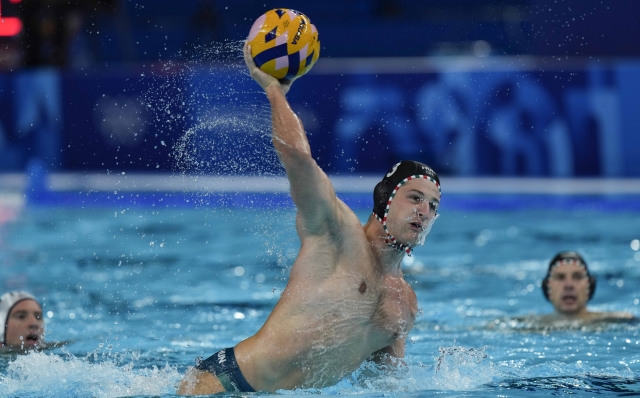 Hungary's Krisztián Angyal scores a penalty during a men's quarterfinal match between Italy and Hungary, at the 2024 Summer Olympics, Wednesday, Aug. 7, 2024, in Paris. (AP Photo/Luca Bruno)