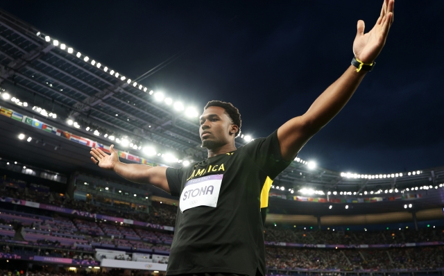 PARIS, FRANCE - AUGUST 07: (EDITORS NOTE: Image was captured using a remote camera) Roje Stona of Team Jamaica celebrates after winning the gold medal and breaking the Olympic record during the Men's Discus Throw Qualification  on day twelve of the Olympic Games Paris 2024 at Stade de France on August 07, 2024 in Paris, France. (Photo by Christian Petersen/Getty Images)