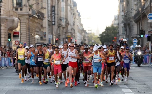 PARIS, FRANCE - AUGUST 10: Rory Linkletter of Team Canada and Ser-Od Bat-Ochir of Team Mongolia lead the field during the Men's Marathon during day fifteen of the Olympic Games Paris 2024 at Esplanade Des Invalides on August 10, 2024 in Paris, France. (Photo by Cameron Spencer/Getty Images)