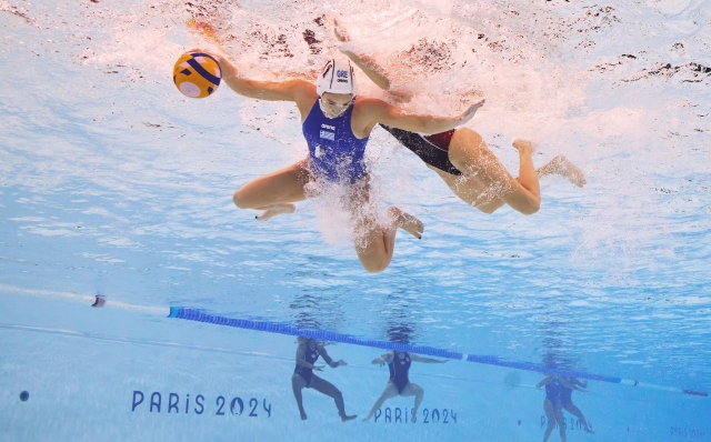 NANTERRE, FRANCE - AUGUST 10: (EDITORS NOTE: Image was captured using an underwater robotic camera.) Athina Dimitra Giannopoulou of Team Greece is challenged in the Women's Classification 7th-8th match between Team Greece and Team Canada on day fifteen of the Olympic Games Paris 2024 at Paris La Defense Arena on August 10, 2024 in Nanterre, France. (Photo by Adam Pretty/Getty Images)