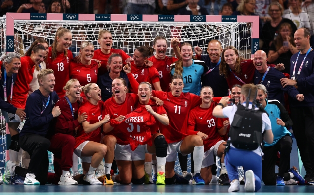 LILLE, FRANCE - AUGUST 10: Bronze medalists Team Denmark pose for photo with a shirt of teammate Simone Petersen (not pictured) after she suffered a foot injury and withdrew from the Olympics after the team's victory in the Women's Bronze Medal Match between Team Denmark and Team Sweden on day fifteen of the Olympic Games Paris 2024 at Stade Pierre Mauroy on August 10, 2024 in Lille, France. (Photo by Alex Davidson/Getty Images)