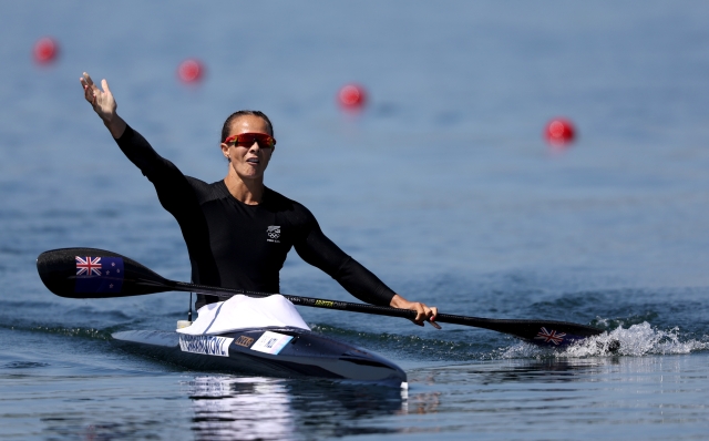 PARIS, FRANCE - AUGUST 10: Lisa Carrington of Team New Zealand, celebrates winning the gold medal after the Women?s 500m Kayak Single 500m Final  on day fifteen of the Olympic Games Paris 2024 at Vaires-Sur-Marne Nautical Stadium on August 10, 2024 in Paris, France. (Photo by Justin Setterfield/Getty Images)