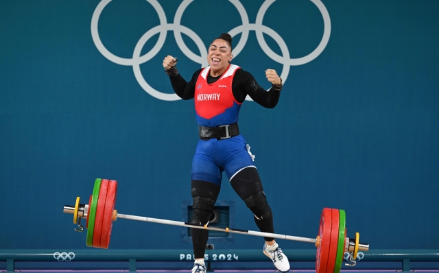 Norway's Solfrid Eila Amena Koanda reacts as she competes in the women's -81kg weightlifting event during the Paris 2024 Olympic Games at the South Paris Arena in Paris, on August 10, 2024. (Photo by ARUN SANKAR / AFP)